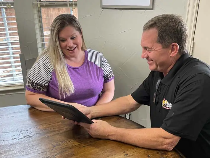 smiling tech with happy customer